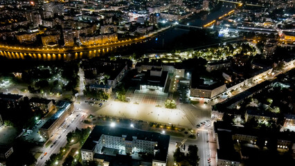 Fototapeta na wymiar Oryol, Russia. Lenin Square. History Center. View of the city from the air. Night flight, Aerial View