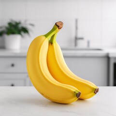 A ripe yellow banana placed on a clean white countertop