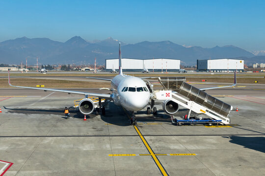 Airplane at the parking in Bergamo airport, Italy.