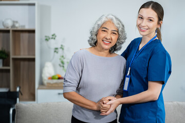 Fototapeta premium Friendly nurse doctor offering patient support during recovery. A loving caregiver taking care of her patient and showing kindness while doing a checkup in assisted living home