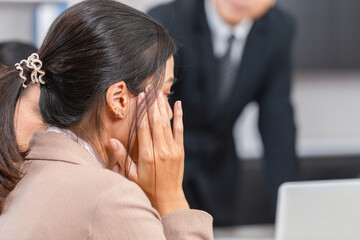 Serious meeting, Young woman headache in a meeting room, female colleague covering her face