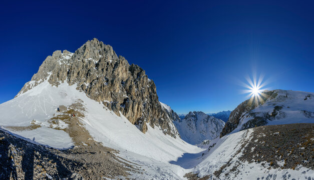 Hoelltoerl with Gruenstein in background at winter on sunny day, Mieming Range, Tyrol, Austria