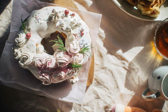 Fresh cake decorated with whipped cream kept on table at home