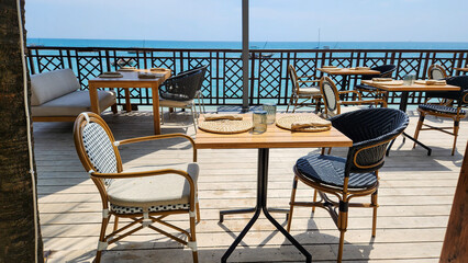 Tables in a restaurant near the beach