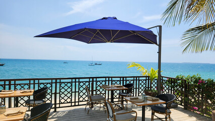 Tables in a restaurant near the beach