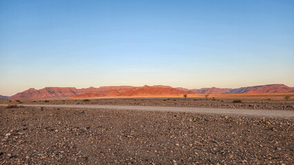 Most of Namibia's deserts are red due to the iron content in the sand.