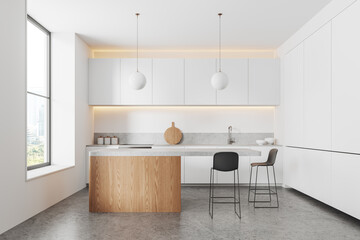 White home kitchen interior with bar counter and cooking cabinet near window