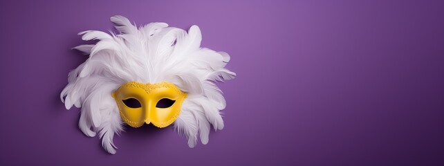 a yellow mask with white feathers
