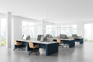 White coworking office corner with blue tables