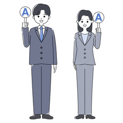 プラカードを持つスーツ姿の男性と女性