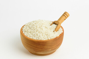white long-grain rice in wooden cup