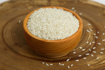 white long-grain rice in wooden cup