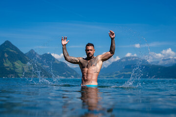 Sexy man in water. Seductive face of a sexy guy. Handsome shirtless man in nature. Muscular male...