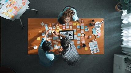 Time lapse of creative designer working together brainstorming idea by using sticky notes at...