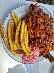 Delicious Tanzania African meal with fish and fried plantains, a perfect combination of flavors