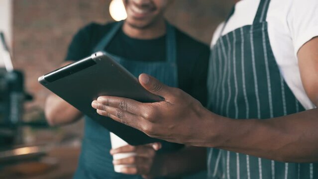 Cafe, happy people and team on tablet for restaurant staff, social media and customer service reviews. Barista or small business owner laughing and hands on digital technology at a coffee shop
