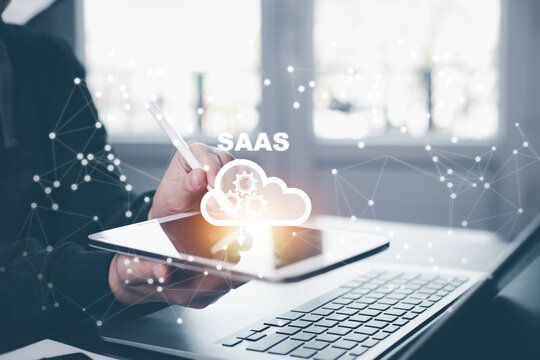 SaaS software as a service concept, Cloud Computing software service, data storage on the Cloud, centralized software management service provider. - Powered by Adobe
