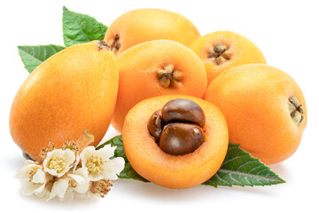 Ripe perfect loquat fruits with green leaves isolated on white background.