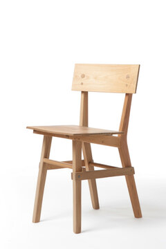 A graceful wooden chair with a backrest made of light wood, isolated on a white background