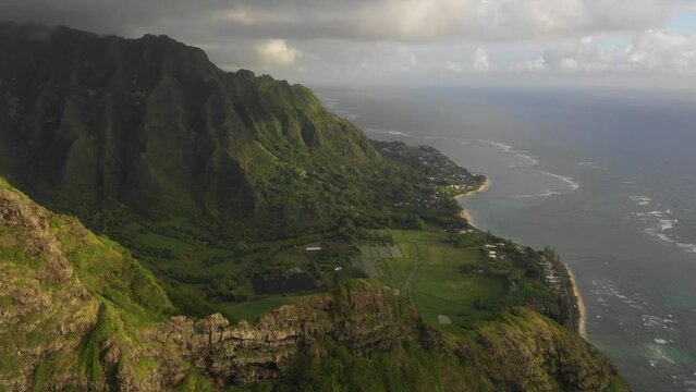 Drone flying towards the Ko'olau mountains on Oahu in Hawai'i at sunrise