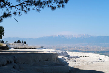 Fantastic view from the travertines of Pamukkale with the valley and the mountains in the background, Denizli, Turkey © Anja