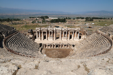The Amphitheater Theater at the archaeological site of Hierapolis with the surrounding landscape in...