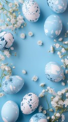 Easter eggs and spring flowers on a blue background with space for text, top view. Generated ai.