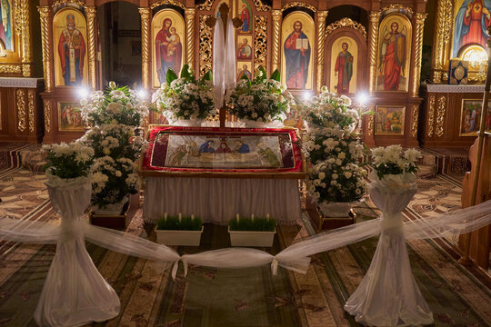 the interior of the church before Easter, Shroud with flowers in the Greek Catholic church at night