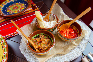 Delicious different sauces and snacks on the table