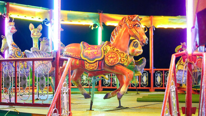 carousel children's merry-go-round for street festival at night time.