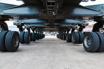The chassis of a large truck crane. Wheelbase of the crane. Many wheels on the crane.