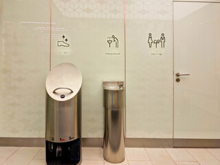 Water drinking fountain and shoe cleaning machinein a public place, shopping mall