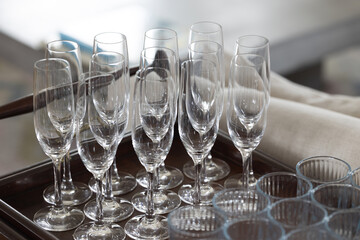 A tray of glasses with a variety of shapes and sizes