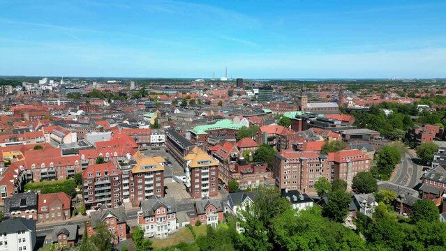 Odense, Denmark: Aerial view of city on island of Funen, summer sunny day with clear blue sky - landscape panorama of Europe from above
