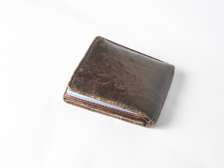 isolated worn brown leather wallet on white background.