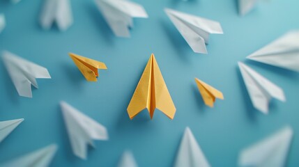 Yellow paper airplane stands out among white