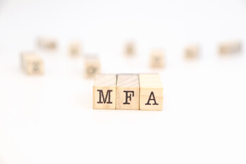 mfa acronym (multifactor authentication) written on wooden cubes. Cybersecurity concept