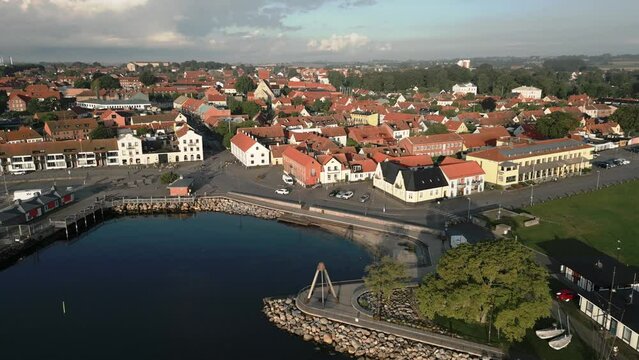 Older houses in coastal town of Simrishamn, Sweden. Forward drone shot.