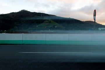 Long exposure image of a car driving fast on the highway