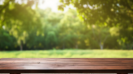 Wooden table in front of blurred nature background with bokeh