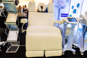 White upholstered beauty treatment chair for spa or beauty salons.