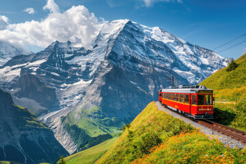 A red train is driving on the tracks in front of snowy mountains, with green grass and yellow flowers growing along both sides of the track. The Eiger Mountain is behind it in the swiss alps. - Powered by Adobe