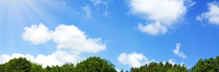 Blue sky background with white clouds. Nature summer background.