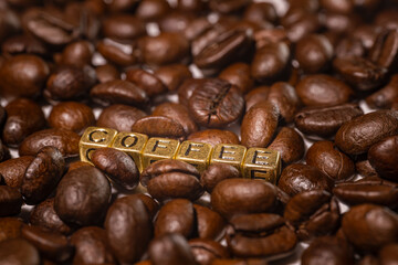 Coffee beans and the inscription coffee on a white background.