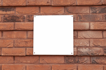 White empty square sign on red brick wall. copy space, place for text