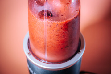 Freshly blended frozen berries in a blender jar.