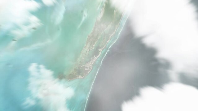 Earth zoom in from space to San Pedro, Belize. Followed by zoom out through clouds and atmosphere into space. Satellite view. Travel intro. Images from NASA
