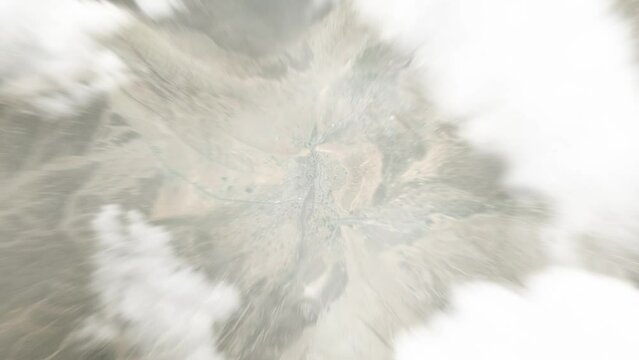 Earth zoom in from space to `Ibri, Oman. Followed by zoom out through clouds and atmosphere into space. Satellite view. Travel intro. Images from NASA