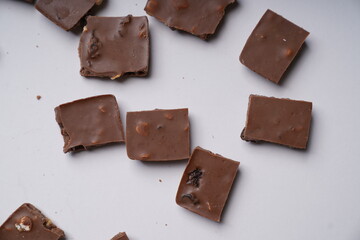 chocolate pieces on a white background