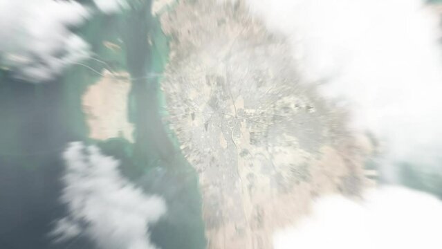 Earth zoom in from space to Madinat Hamad, Bahrain. Followed by zoom out through clouds and atmosphere into space. Satellite view. Travel intro. Images from NASA